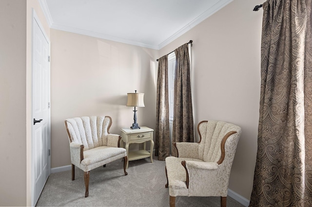 living area with carpet flooring, baseboards, and ornamental molding