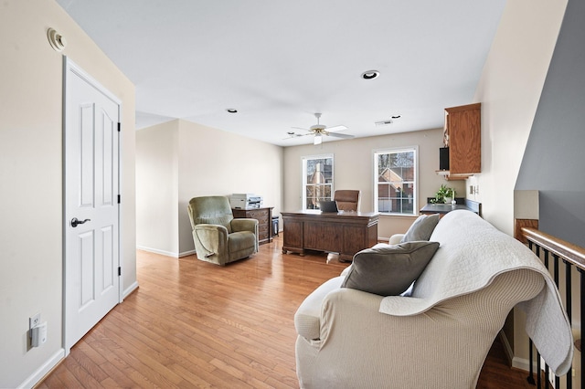 living room featuring recessed lighting, light wood-type flooring, baseboards, and a ceiling fan