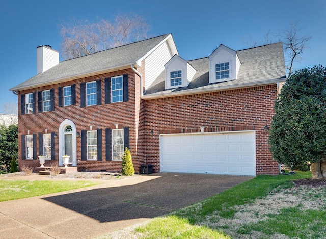 view of front facade featuring a garage, driveway, roof with shingles, crawl space, and brick siding