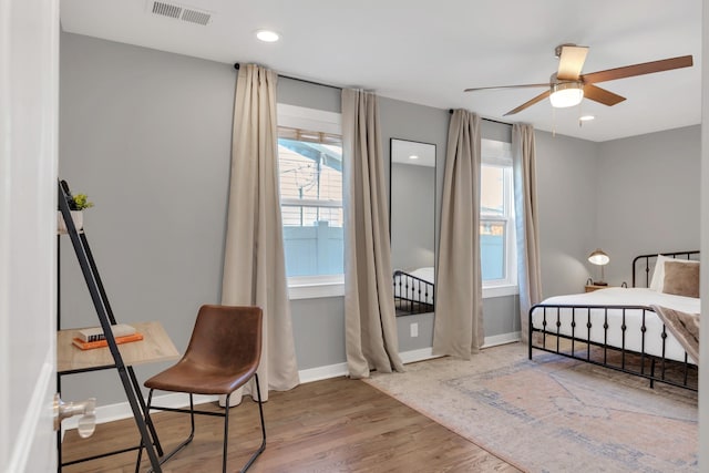 bedroom featuring visible vents, recessed lighting, baseboards, and wood finished floors