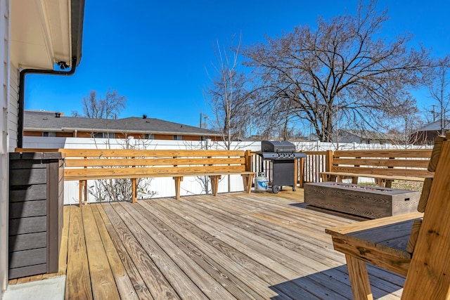 wooden deck featuring area for grilling and fence