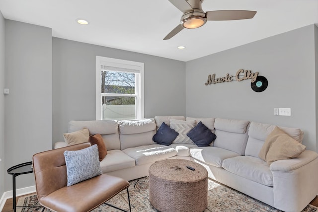 living area with wood finished floors, recessed lighting, baseboards, and ceiling fan