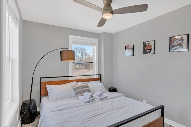 bedroom with baseboards and ceiling fan