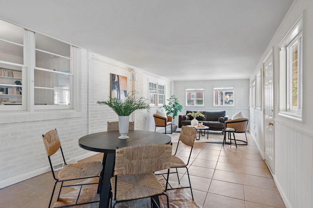 dining space with light tile patterned floors