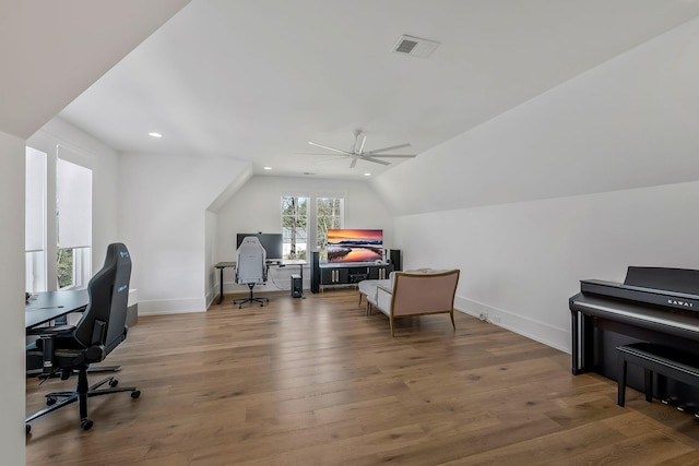 office area featuring visible vents, hardwood / wood-style floors, recessed lighting, baseboards, and lofted ceiling