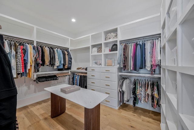 spacious closet featuring light wood-style flooring