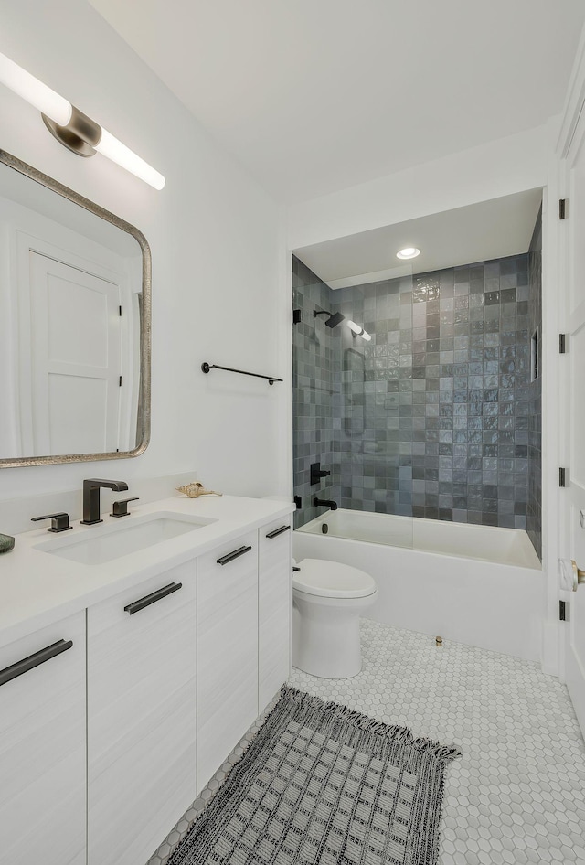 full bathroom featuring shower / bathing tub combination, toilet, vanity, and tile patterned flooring