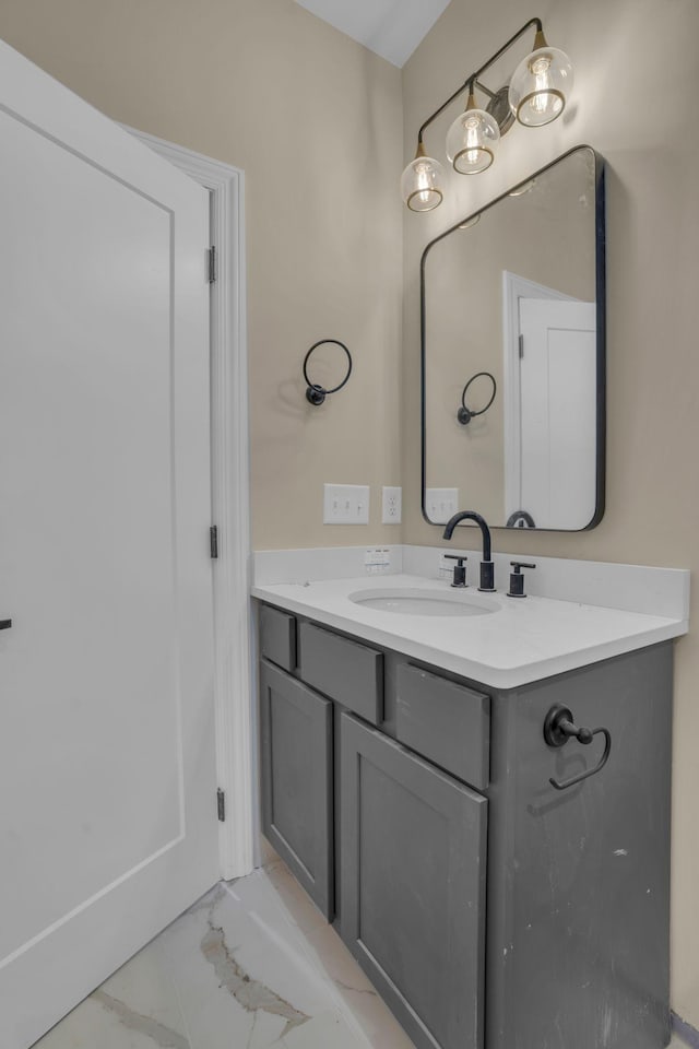 bathroom featuring vanity and marble finish floor