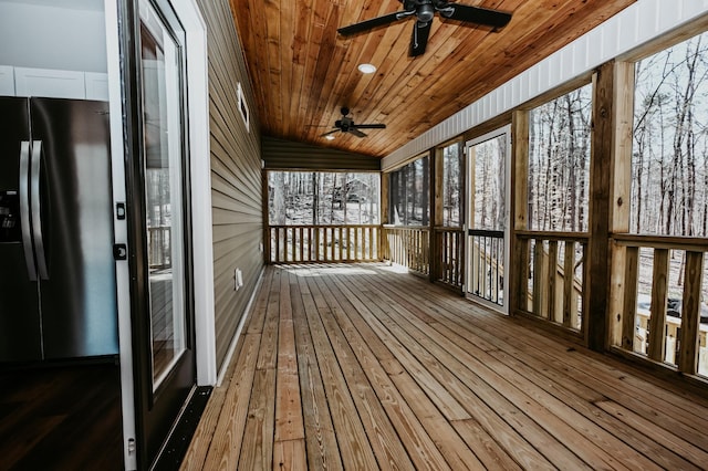 wooden terrace featuring ceiling fan