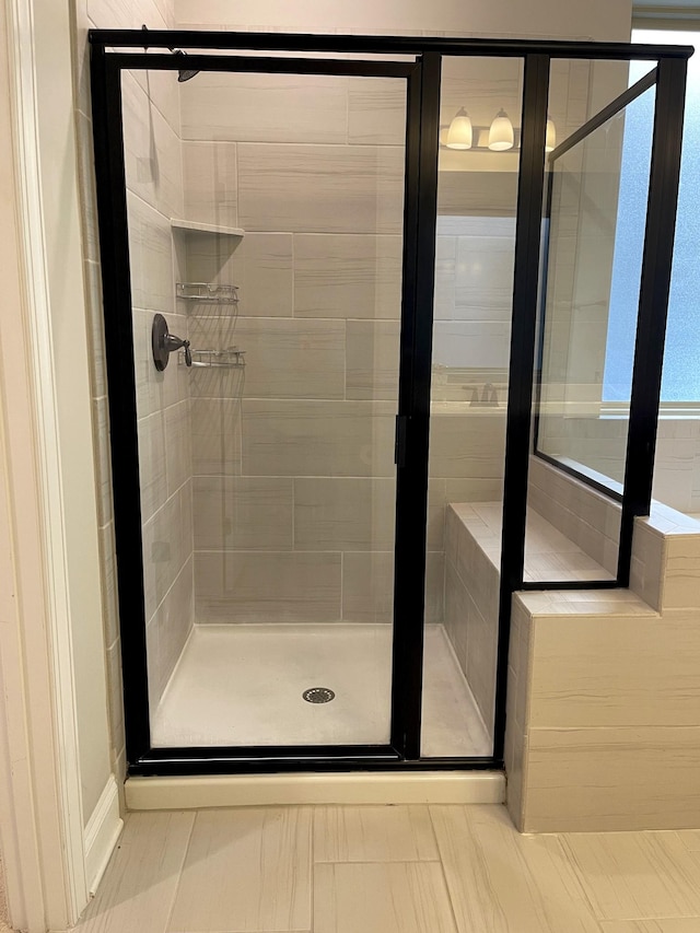 full bath featuring a shower stall