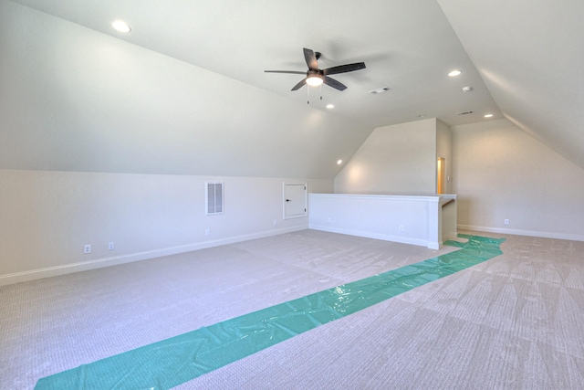 bonus room with baseboards, visible vents, lofted ceiling, recessed lighting, and light carpet