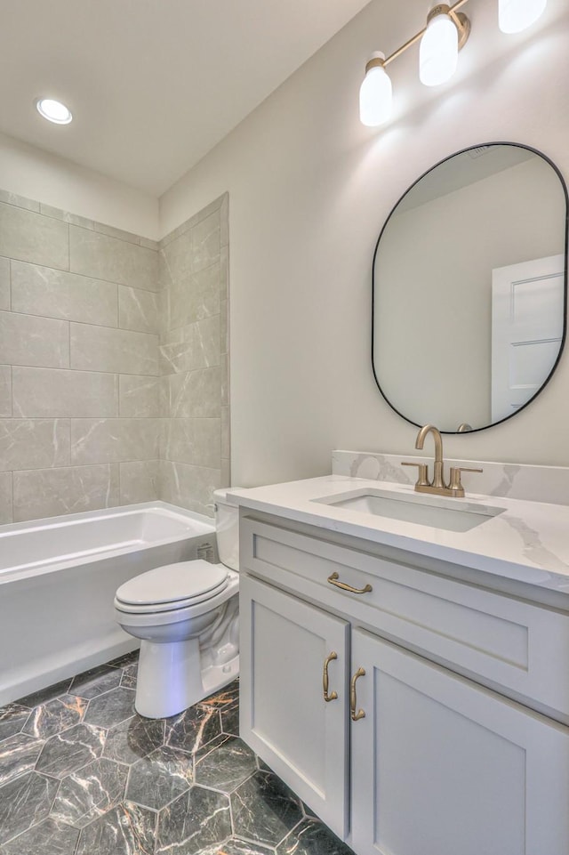 full bath with toilet, vanity, and bathing tub / shower combination