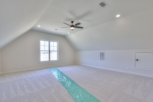 additional living space featuring visible vents, baseboards, and light colored carpet