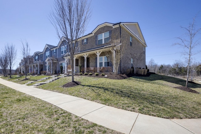 view of front of property with a front lawn, a porch, and a residential view