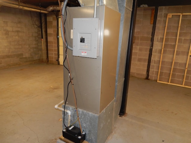 utility room featuring heating unit