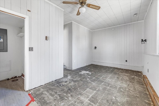 spare room featuring crown molding, electric panel, and a ceiling fan