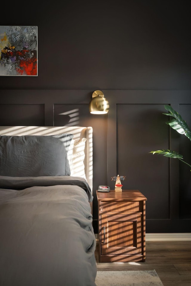 bedroom featuring wood finished floors