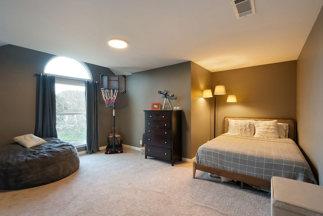 carpeted bedroom featuring visible vents and baseboards