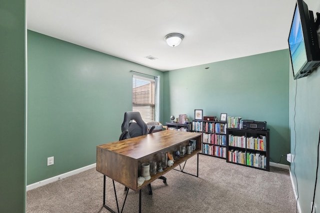 office space with carpet flooring, visible vents, and baseboards