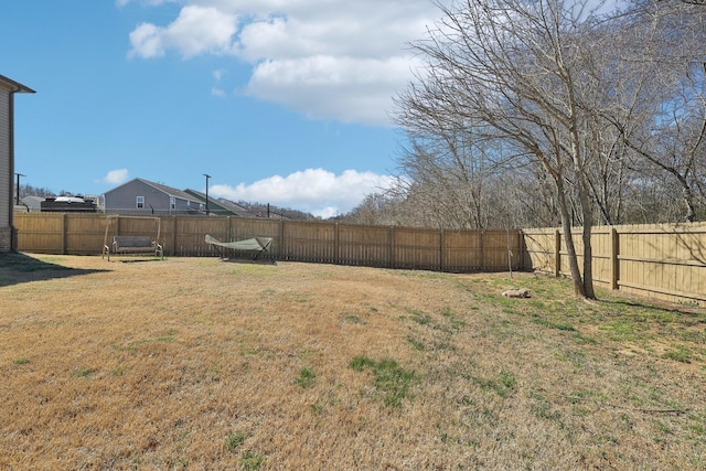 view of yard featuring a fenced backyard