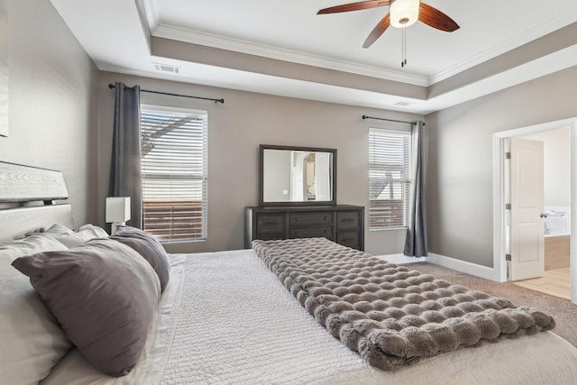 bedroom featuring visible vents, a raised ceiling, crown molding, carpet flooring, and baseboards