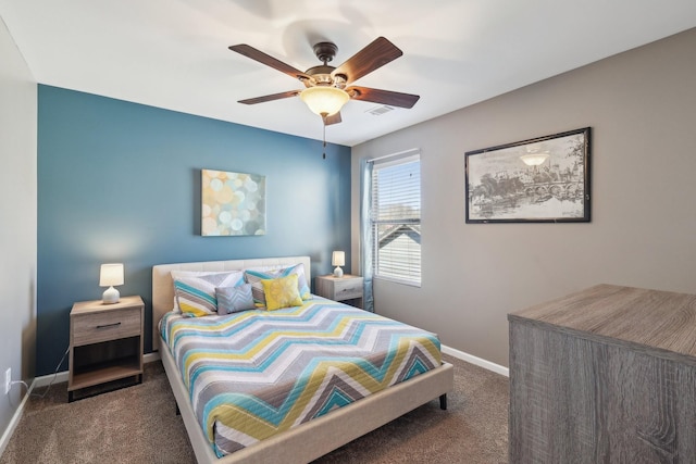 carpeted bedroom with visible vents, baseboards, and ceiling fan