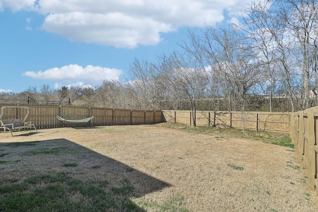 view of yard featuring a fenced backyard