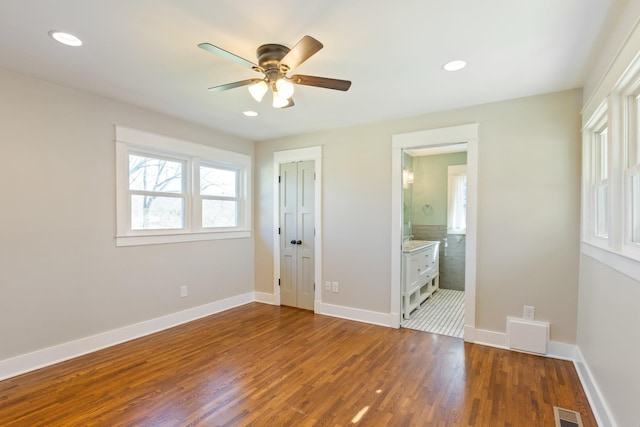 unfurnished bedroom with recessed lighting, visible vents, baseboards, and wood finished floors