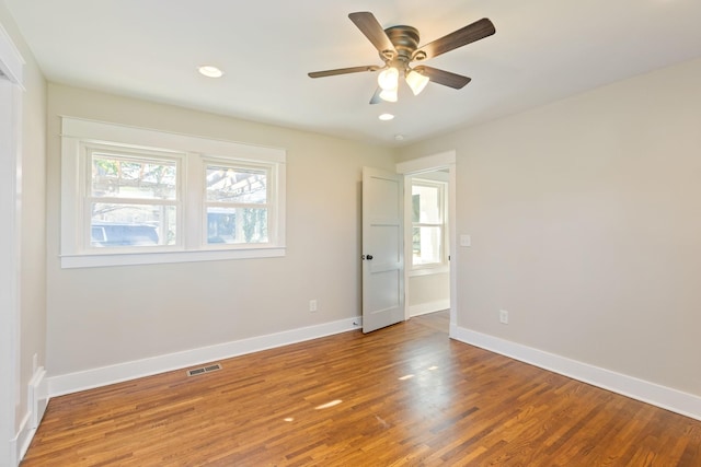 unfurnished bedroom with recessed lighting, baseboards, and wood finished floors