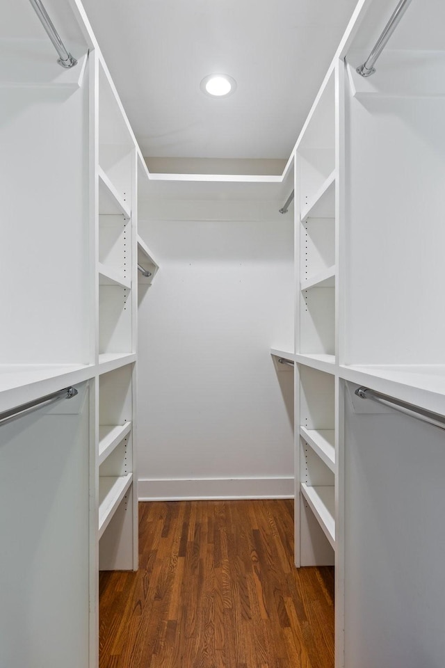 spacious closet with wood finished floors