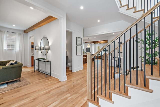 entryway with recessed lighting, stairs, baseboards, and wood finished floors