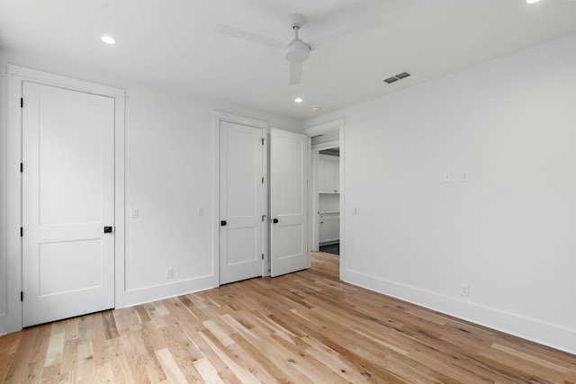 unfurnished bedroom featuring visible vents, recessed lighting, light wood finished floors, baseboards, and ceiling fan