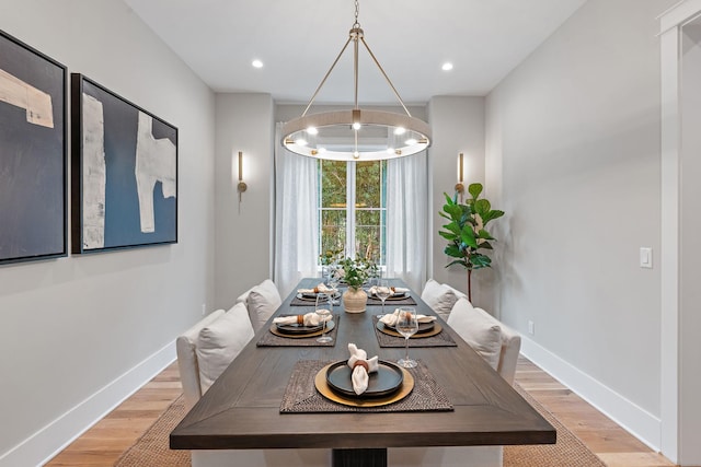 dining space featuring an inviting chandelier, recessed lighting, baseboards, and light wood-type flooring