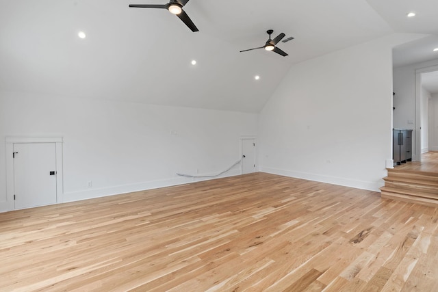 unfurnished room with baseboards, light wood-style floors, ceiling fan, and vaulted ceiling