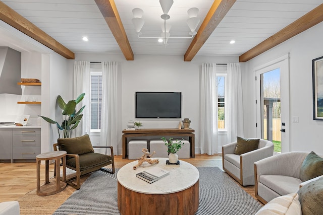 living room featuring beamed ceiling, recessed lighting, and light wood-style floors