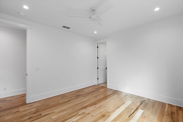 unfurnished room featuring visible vents, recessed lighting, and wood finished floors