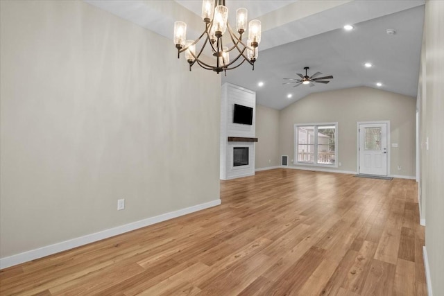 unfurnished living room with a chandelier, ceiling fan, a large fireplace, recessed lighting, and baseboards