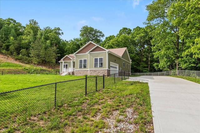 craftsman-style house with driveway, stone siding, and a garage