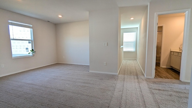 unfurnished room featuring recessed lighting, baseboards, and carpet floors