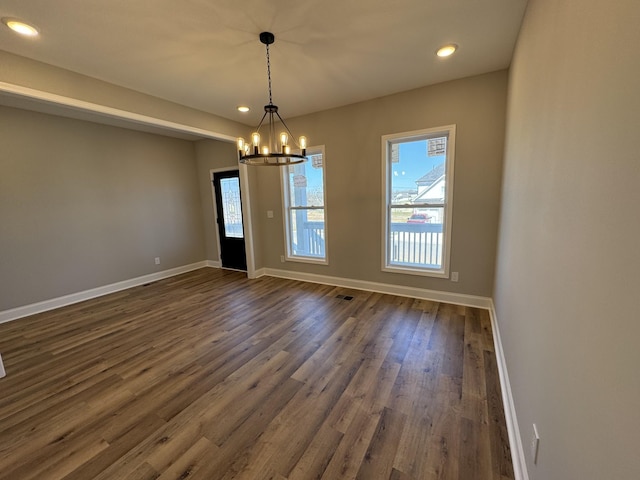 unfurnished room featuring visible vents, baseboards, a chandelier, recessed lighting, and dark wood-style floors