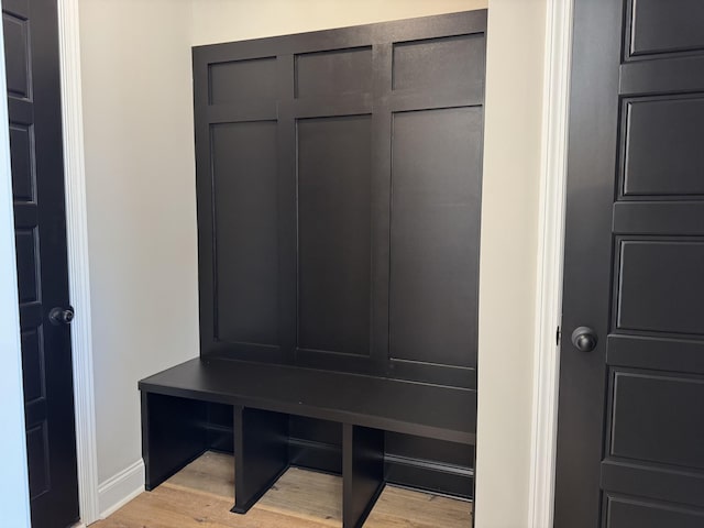 mudroom featuring baseboards and light wood-style flooring