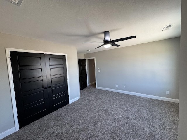 unfurnished bedroom with visible vents, a ceiling fan, a closet, carpet floors, and baseboards