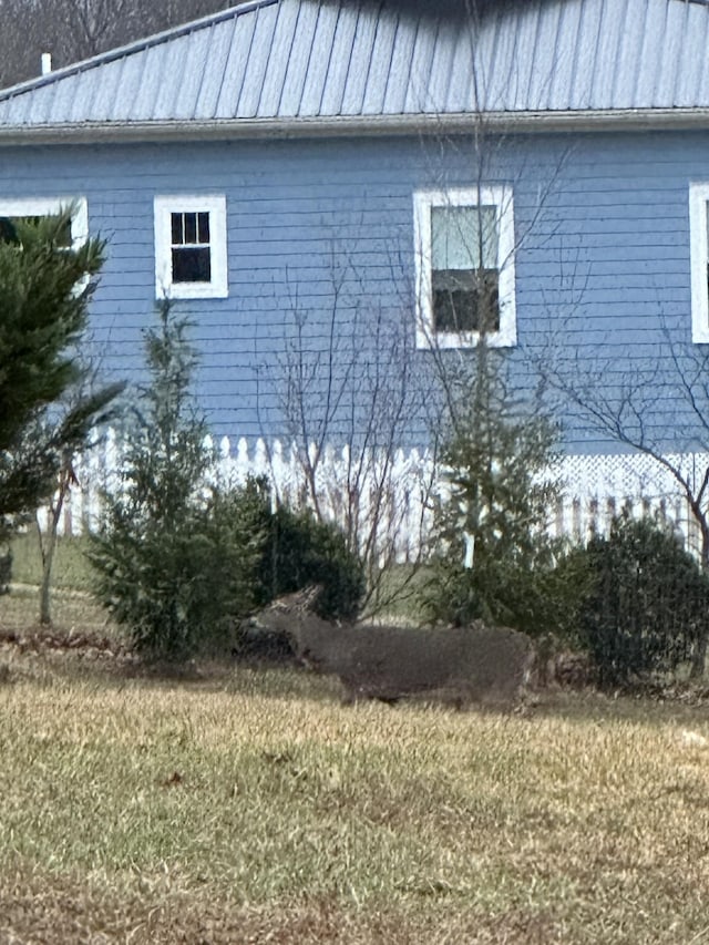 view of home's exterior featuring metal roof