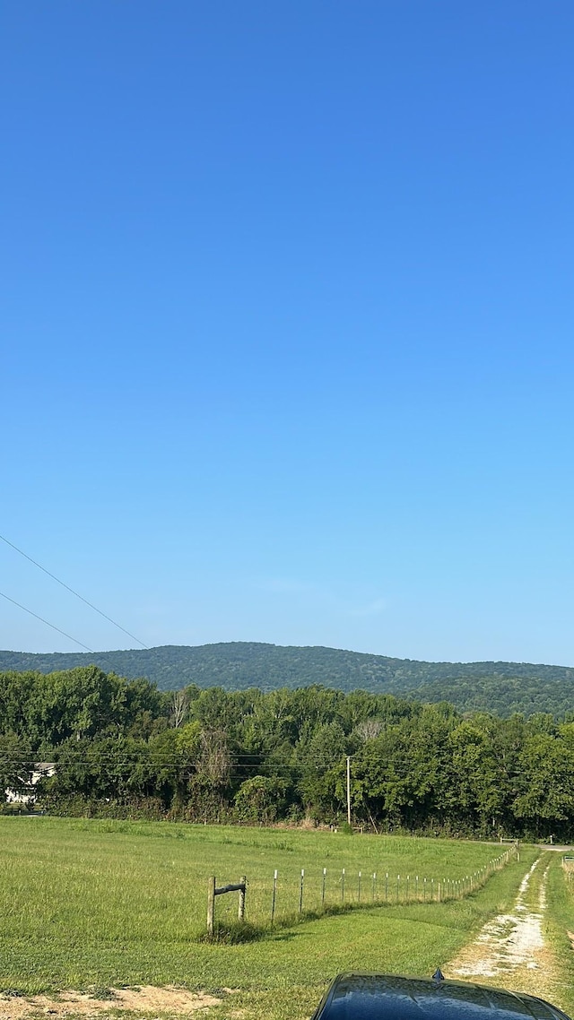 property view of mountains featuring a rural view and a wooded view