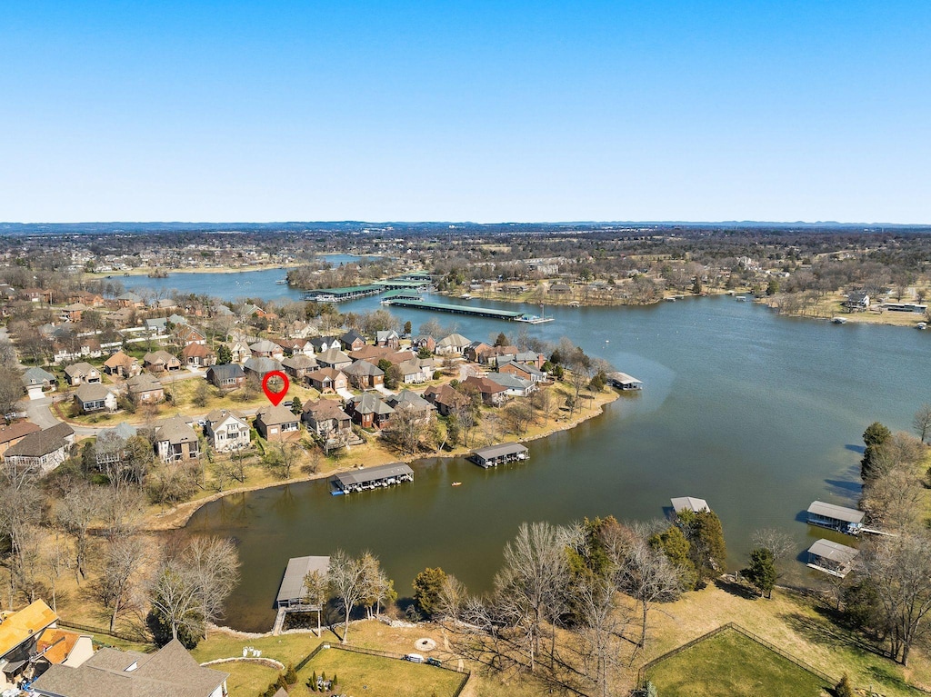 birds eye view of property featuring a residential view and a water view