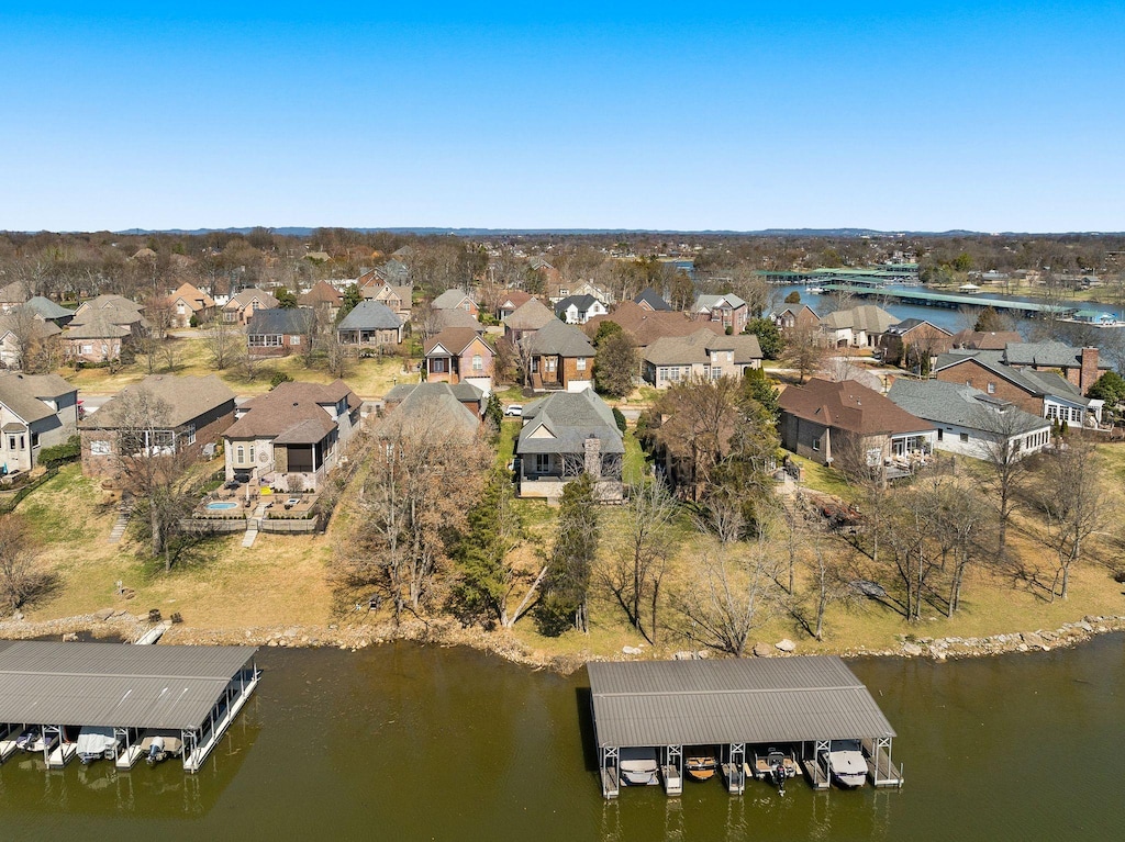 birds eye view of property featuring a residential view and a water view