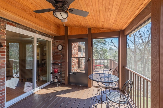 unfurnished sunroom featuring lofted ceiling and wood ceiling