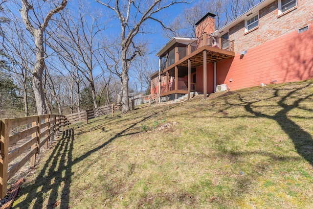 view of yard featuring a deck and fence