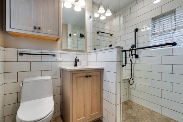 full bathroom featuring vanity, toilet, tile walls, and walk in shower