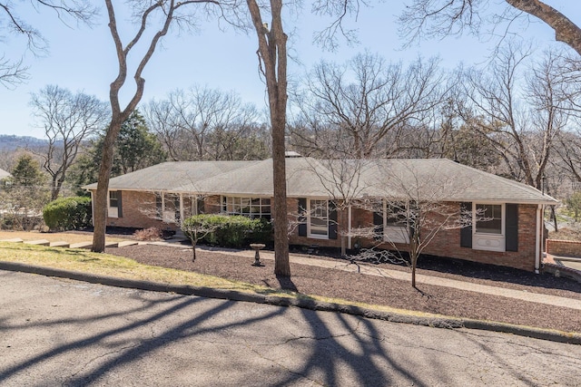 ranch-style house with brick siding